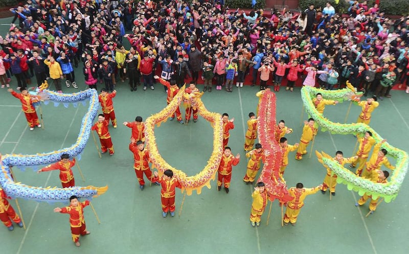 Students with dragon dance props form “2015” to welcome the upcoming New Year at an art school in Hefei, Anhui province in China. Reuters