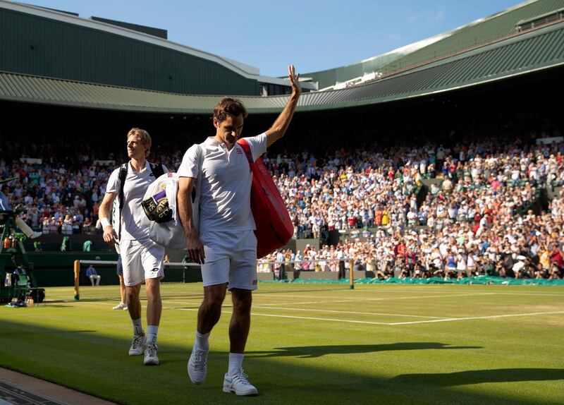 LONDON, ENGLAND - JULY 11: Roger Federer of Switzerland thanks the crowd after losing his Men's Singles Quarter-Finals match against Kevin Anderson of South Africa on day nine of the Wimbledon Lawn Tennis Championships at All England Lawn Tennis and Croquet Club on July 11, 2018 in London, England. Anderson won the match 6-2, 7-6, 5-7, 4-6, 11-13 in 4hr 13min. (Photo by Julian Finney/Getty Images)