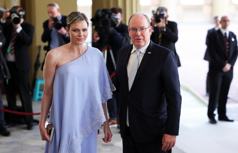 Prince Albert II of Monaco and his wife Charlene, Princess of Monaco, arrive at the reception. Reuters