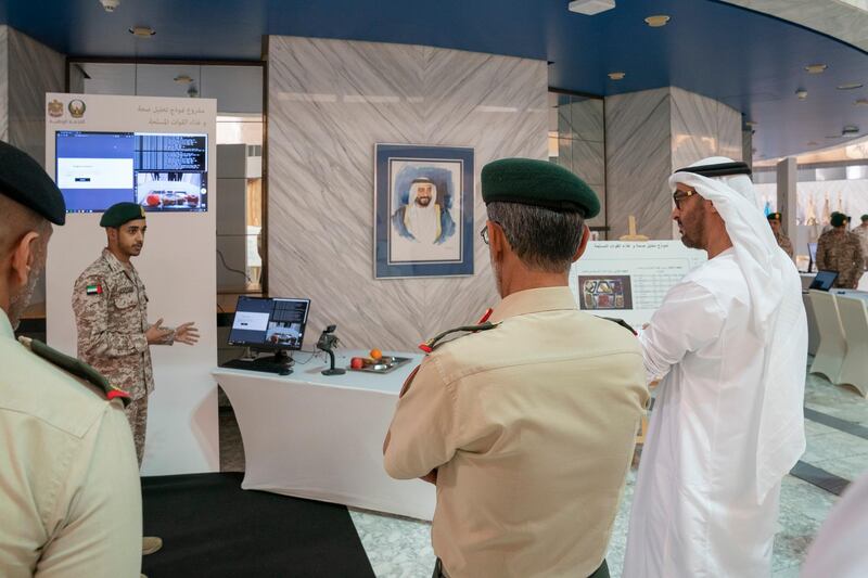 ABU DHABI, UNITED ARAB EMIRATES - April 28, 2019: HH Sheikh Mohamed bin Zayed Al Nahyan, Crown Prince of Abu Dhabi and Deputy Supreme Commander of the UAE Armed Forces (R), attends e-skills exhibition for national service recruits, at Armed Forces Officers Club.
( Mohamed Al Hammadi / Ministry of Presidential Affairs )
---