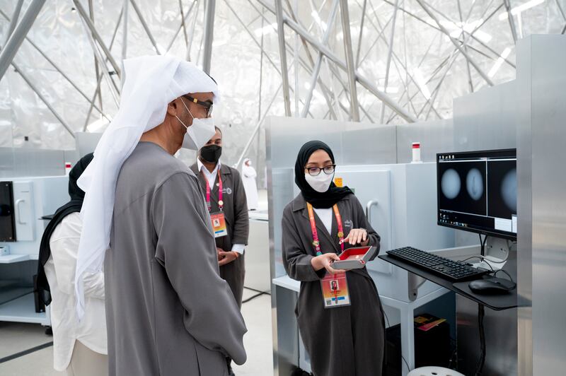 Sheikh Mohamed meets staff at the pavilion.