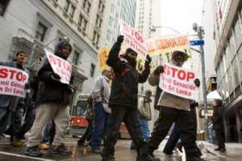 Pro Tamil protesters march in the streets of Toronto on Friday Jan. 30, 2009 to protest events in Sri Lanka. Hundreds of people formed a human chain through Toronto's downtown to protest a Sri Lankan government offensive aimed at crushing the separatist Tamil Tigers. (AP Photo/ THE CANADIAN PRESS/Frank Gunn)