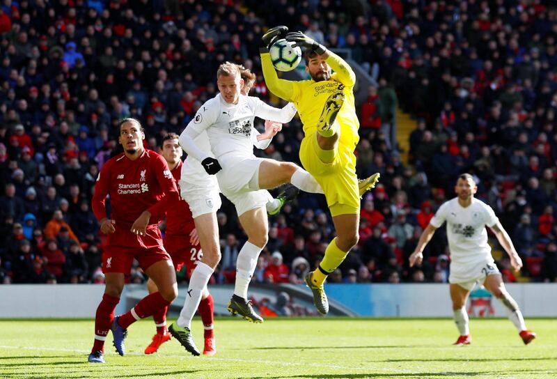 Liverpool's Alisson in action. Reuters