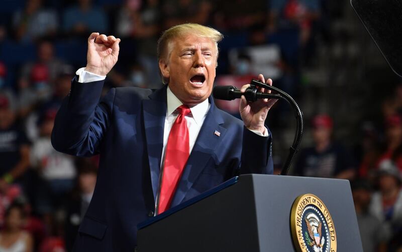 TOPSHOT - US President Donald Trump speaks during a campaign rally at the BOK Center on June 20, 2020 in Tulsa, Oklahoma. Hundreds of supporters lined up early for Donald Trump's first political rally in months, saying the risk of contracting COVID-19 in a big, packed arena would not keep them from hearing the president's campaign message. / AFP / Nicholas Kamm
