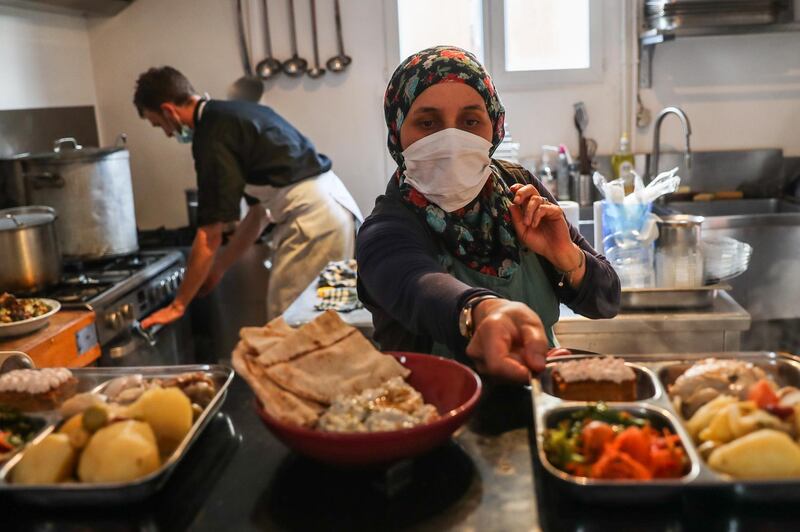 Entissar Jamous, a Syrian refugee helps to cook for the charity organization 'La Pagaille' in Paris, France.  The 49-year-old does some voluntary activities in Paris. In Syria, she worked as a Dental Technician for 15 years. She left Syria to Lebanon in 2013, then arrived to Paris in 2015. Mother of three sons and one daughter, Jamous works hard to be integrated in the French community. She majored in Arabic Literature at university and graduated in 2019. And her message on World Refugee Day is: 'Like all refugees around the world, I have to live again. I appreciate life, and I like the sun, the moon, roses, and colors. I am a social person. I like talking to people, but language was a big problem. That pushed me to get over it with a lot of determination and hard work. I think I succeeded. Now, I pay more attention to finding a job. It is very difficult for me to work with my previous profession as a Dental Technician in France. That pushed me to go to the university, which I donâ€™t think I will stop because it keeps me hanging on and loving this country more and more. I enjoyed studying Arabic literature in Paris, it gave me love and hope. EPA
