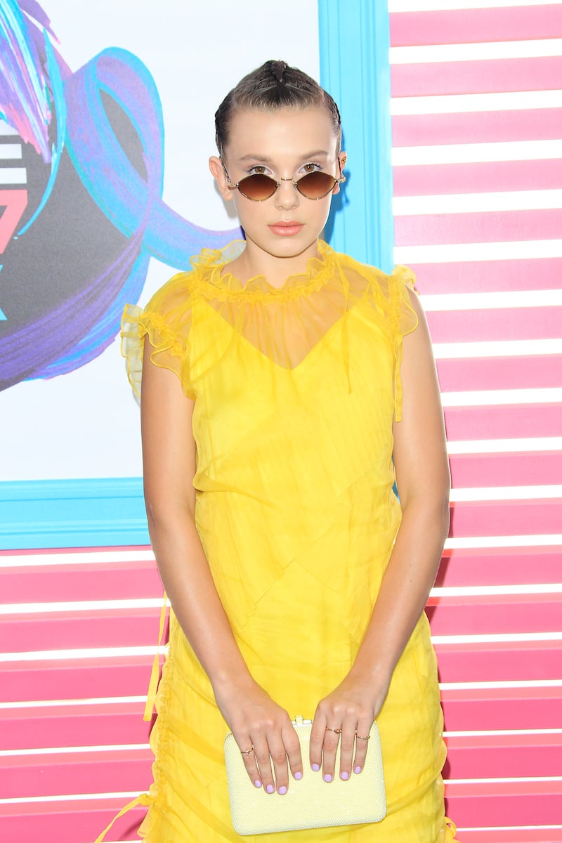 Millie Bobby Brown, wearing yellow Kenzo, arrives for the Teen Choice Awards in Los Angeles on August 13, 2017. EPA 