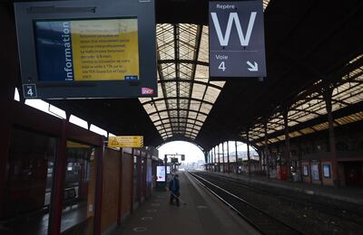 A train station worker stands on a deserted platform at the main train station at Strasbourg, north-western France on Tuesday. AFP