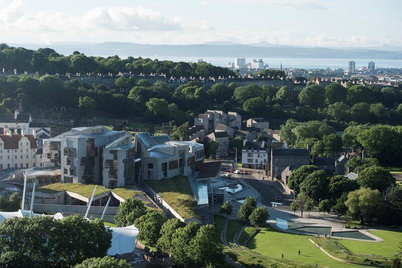 The Scottish Parliament is pictures at sunset from Salisbury Crags in Holyrood Park, Edinburgh, Scotland on June 25, 2016, following the pro-Brexit result of the UK's EU referendum vote. - The result of Britain's June 23 referendum vote to leave the European Union (EU) has pitted parents against children, cities against rural areas, north against south and university graduates against those with fewer qualifications. London, Scotland and Northern Ireland voted to remain in the EU but Wales and large swathes of England, particularly former industrial hubs in the north with many disaffected workers, backed a Brexit. (Photo by OLI SCARFF / AFP)