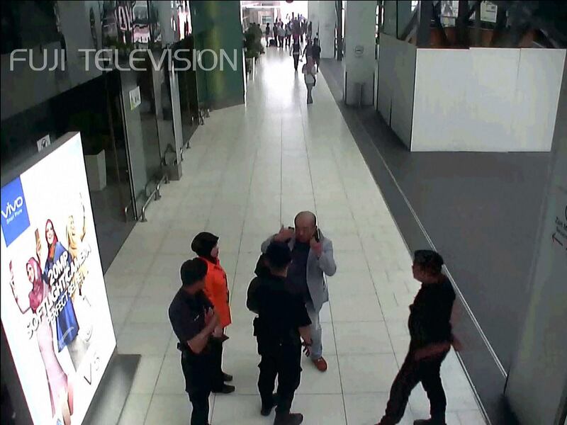 This screengrab from CCTV footage obtained by Fuji TV shows Kim Jong-Nam, the North Korean leader's half brother, speaking to airport authorities at Kuala Lumpur International Airport. Fuji TV / AFP