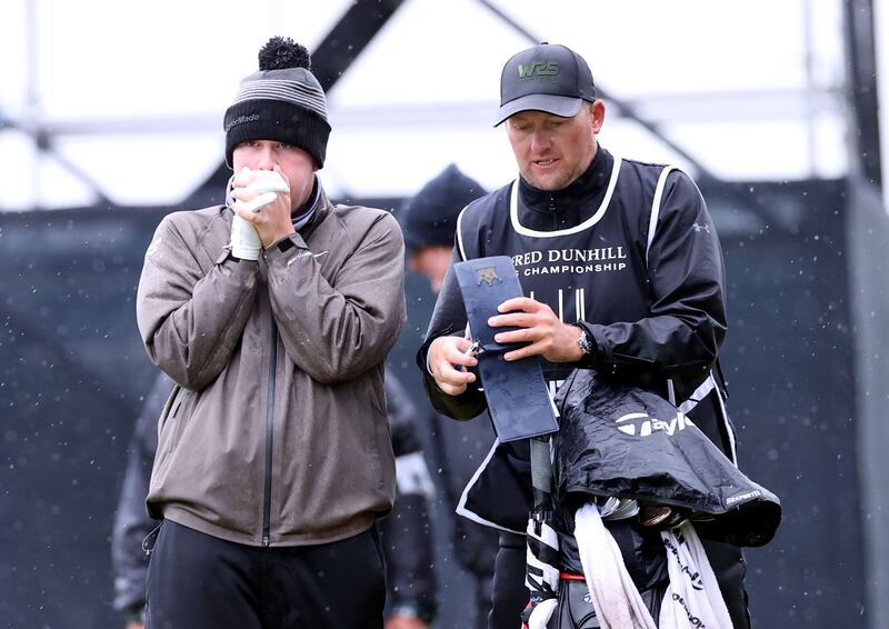 Robert Macintyre keep his hands warm during the Alfred Dunhill Links Championship. PA