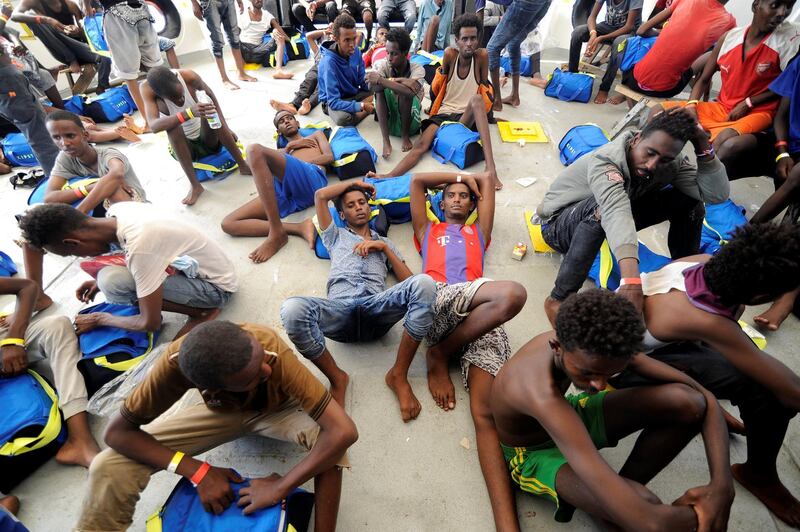 Migrants rest after being rescued by SOS Mediterranee off the Libyan Coast. Reuters