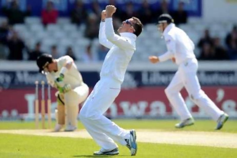 Graeme Swann, right, celebrates taking the wicket of New Zealand batsman Martin Guptill. Philip Brown / Reuters