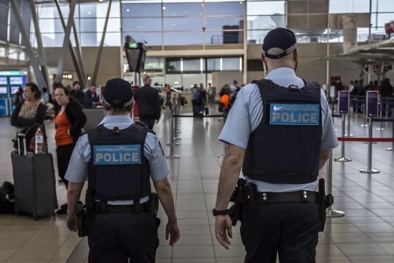 SYDNEY, AUSTRALIA - JULY 31:  Australian Federal Police Officers patrol Sydney Airport on July 31, 2017 in Sydney, Australia. Counter terrorism police raided four houses across Sydney on Saturday night and arrested four men over an alleged terror plot that involved blowing up an aircraft. Australian travellers have been warned to expect major delays at airports around the country with security screening measures ramped up following the raids.  (Photo by Brook Mitchell/Getty Images)