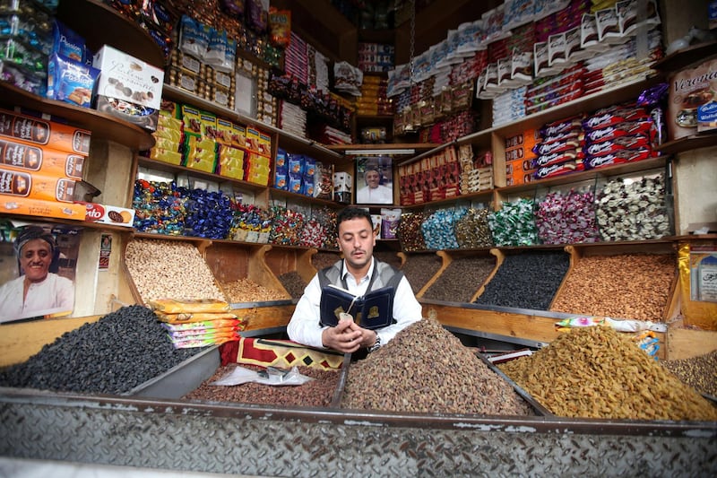 A spices vendor recites the Quran as he waits for customers in Sanaa, Yemen. Reuters