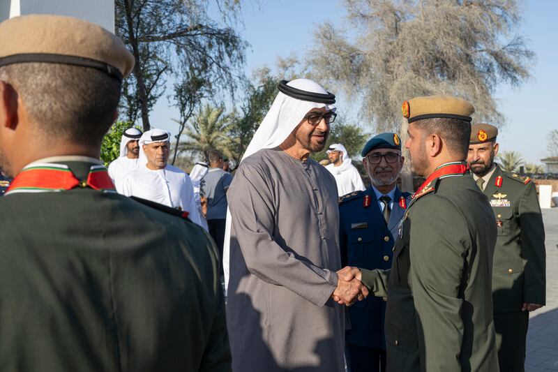 President Sheikh Mohamed, accompanied by Maj Gen Essa Saif Al Mazrouei, greets a member of the UAE Armed Forces