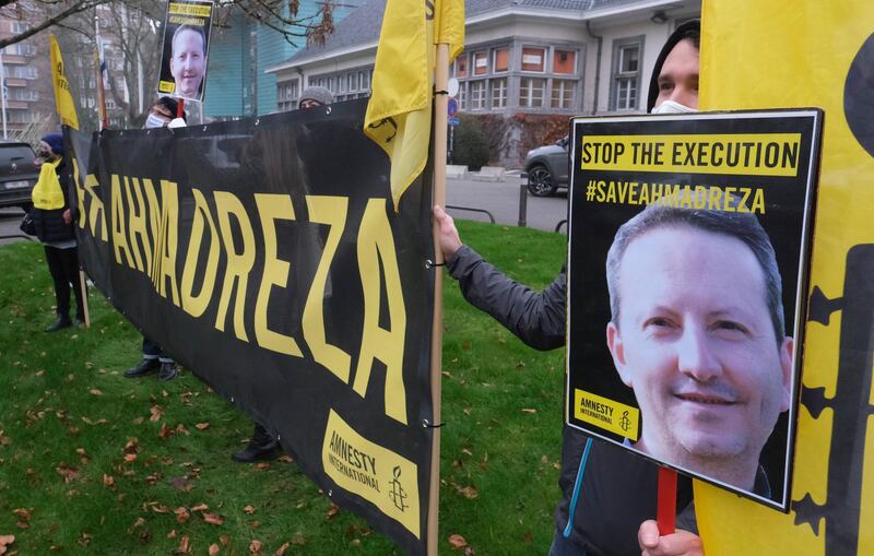 epa08852892 Amnesty international activists protest against the death sentence of Swedish-Iranian scientist Ahmadreza Djalali, who was convicted of espionage, near the Iranian embassy in Brussels, Belgium, 30 November 2020. Djalali, a medical doctor and lecturer at Swedish and Belgium universities, was arrested in Iran in 2016 and sentenced to death in October 2017.  EPA/OLIVIER HOSLET