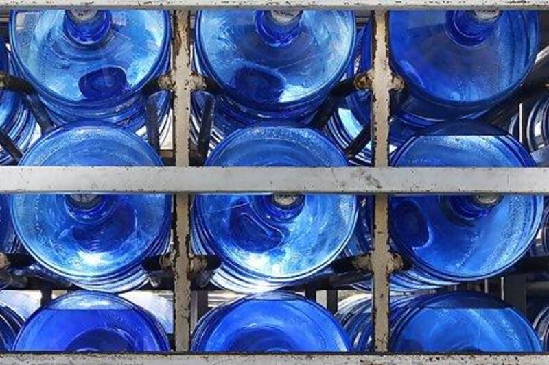 Mineral water bottles in one of the water supply truck at discovery gardens area in Dubai. Pawan Singh / The National