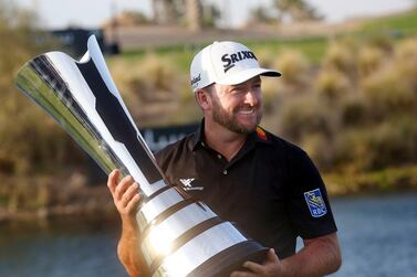 Graeme McDowell celebrates with the trophy after winning the Saudi International on Sunday. AP Photo