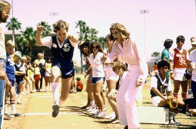 Eunice Kennedy (R) encouraging Special Olympian Karen Fosdick on her way to a gold medal.  (Photo by John Dominis/The LIFE Images Collection/Getty Images)