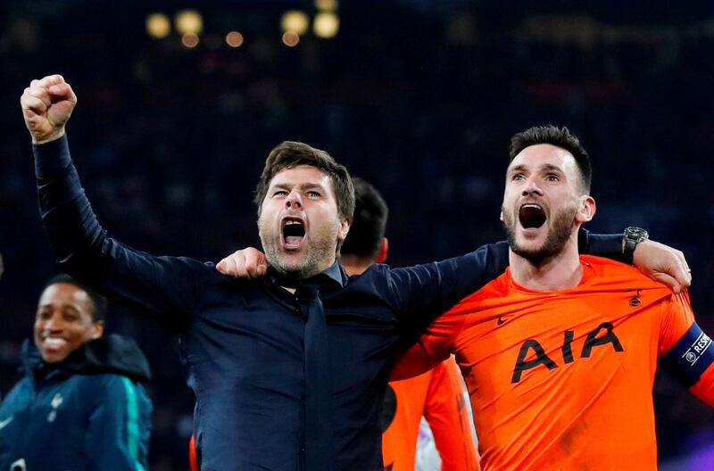 Tottenham manager Mauricio Pochettino and goalkeeper Hugo Lloris celebrate. Reuters