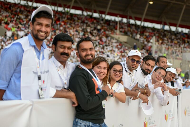 Eucharistic volunteers excited for the early morning Papal mass. Khushnum Bhandari / The National
