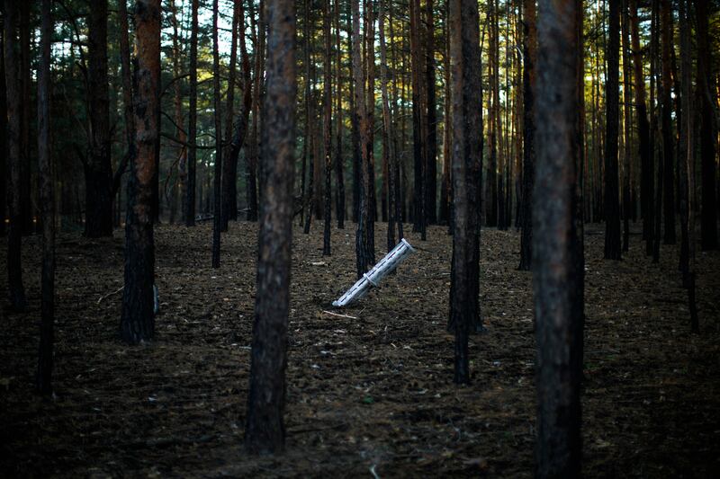A Russian rocket sticks out of the ground in a forest near Oleksandrivka village, in Kherson region, southern Ukraine. AP