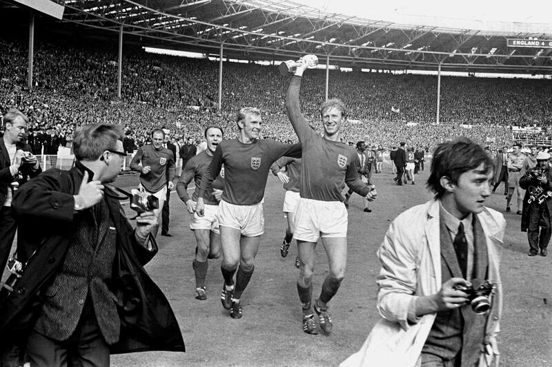 England's Jack Charlton holds the Jules Rimet trophy aloft as he parades it around Wembley with teammates Ray Wilson (l), George Cohen (second l) and Bobby Moore (second r) following their 4-2 win. World Cup-winning England defender and former Republic of Ireland manager Jack Charlton has died at the age of 85, his family said in a statement. PA