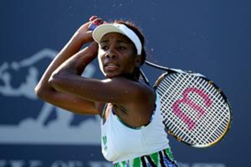 Venus Williams returns a shot against China's Li Na