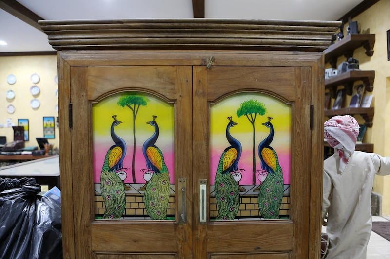 An antique, painted cupboard on display in Jasim Al Ali's museum home in Sharjah. Pawan Singh / The National