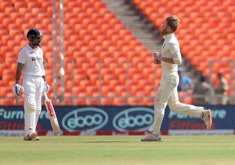 England's Ben Stokes, right, celebrates the dismissal of India's captain Virat Kohli. AP
