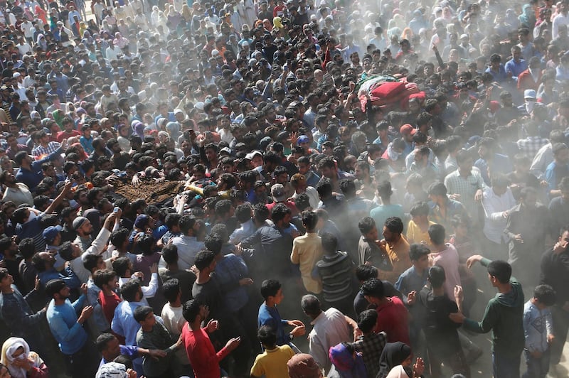 People carry the bodies of Sajjad Ahmad Bhat and Tawseef Ahmad Bhat, suspected militants who were killed during a gun battle with Indian security forces, during their funeral procession in Marhama village in South Kashmir. Reuters