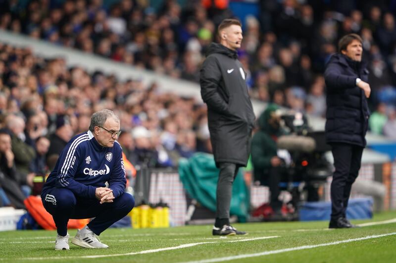 Leeds United manager Marcelo Bielsa crouches on the touchline at Elland Road as he watches his side's match against Tottenham. PA
