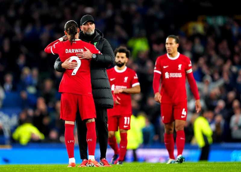 Darwin Nunez hugs manager Jurgen Klopp after defeat to Everton leaves Liverpool's title hopes in tatters. PA