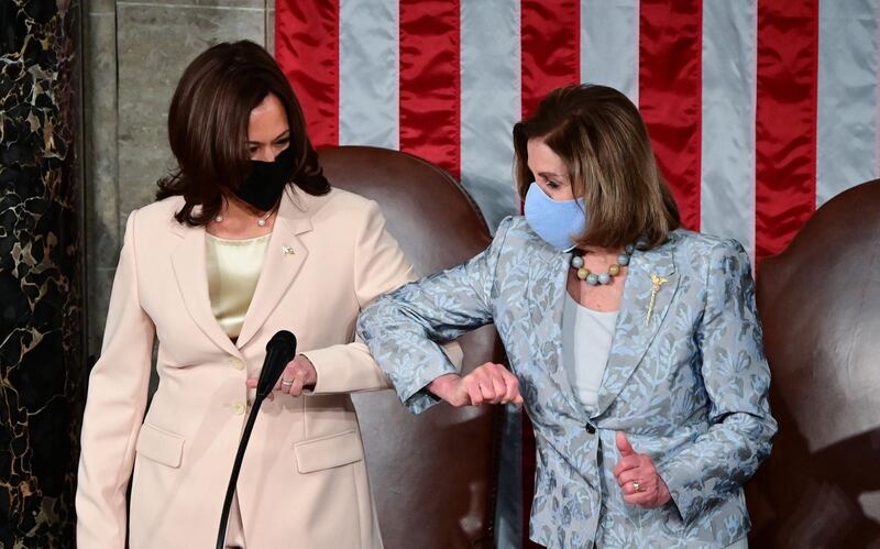 US Vice President Kamala Harris, left, greets House of Representatives Speaker Nancy Pelosi, Democrat of California, ahead of US President Joe Biden addressing a joint session of Congress at the US Capitol in Washington, DC. AFP