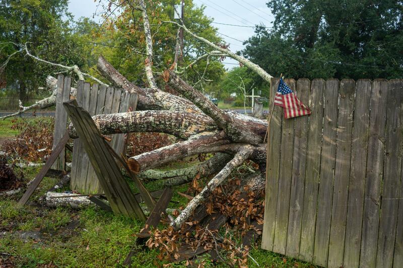 A tree blown down onto a fence by Hurricane Laura still remains as Hurricane Delta approaches in Perry, Louisiana. Reuters