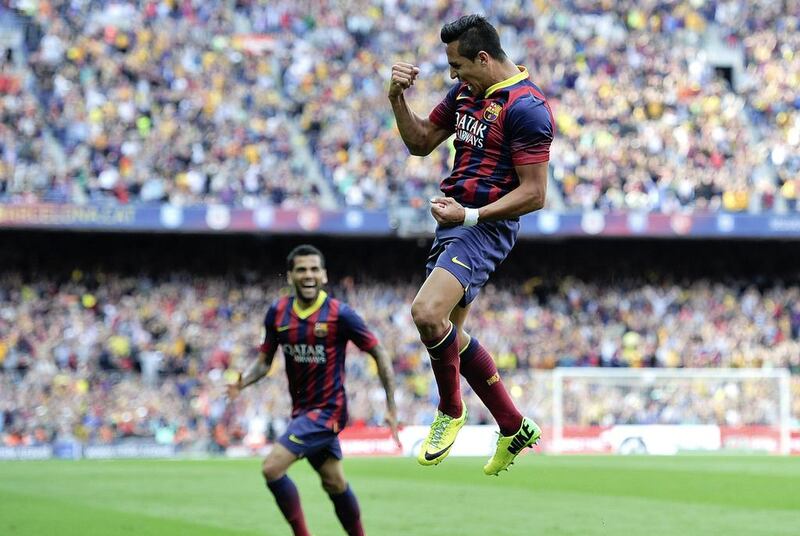 Barcelona forward Alexis Sanchez celebrates his goal against Atletico Madrid on Saturday. Josep Lago / AFP / May 17, 2014