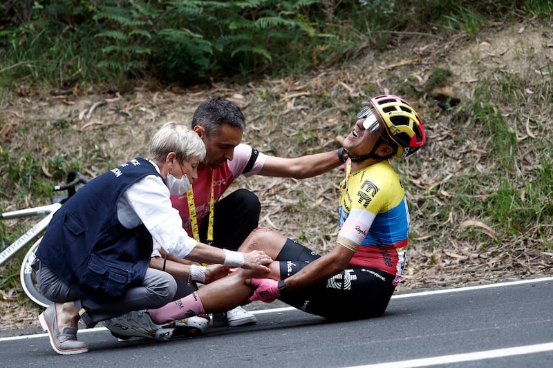 EasyPost's Richard Carapaz receives medical attention after a crash. Reuters