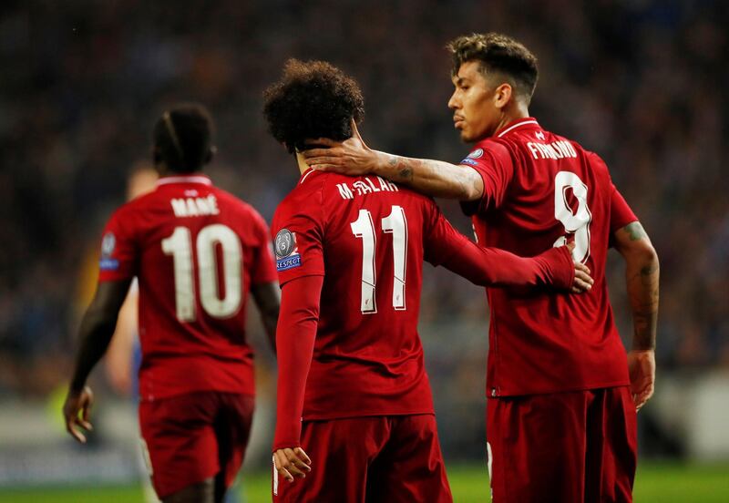 Roberto Firmino congratulates Salah. Andrew Boyers / Reuters