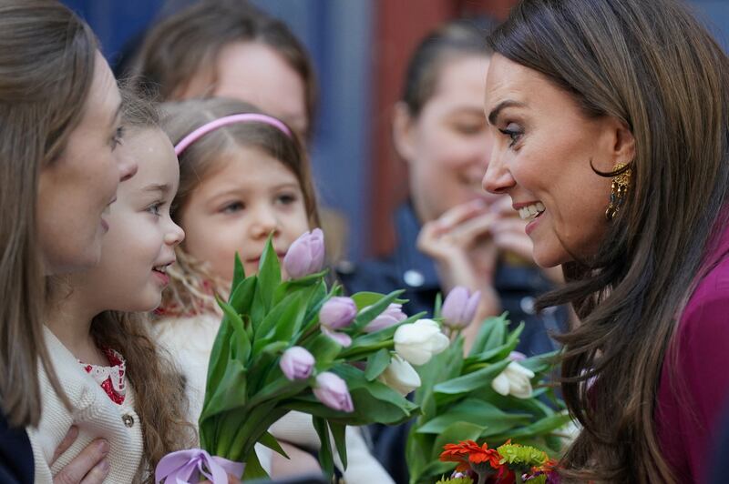 The Princess of Wales speaks with local children. Reuters