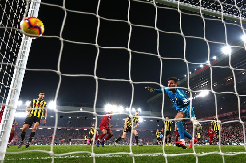 LIVERPOOL, ENGLAND - FEBRUARY 27: Virgil van Dijk of Liverpool scores his team's fifth goal past Ben Foster of Watford during the Premier League match between Liverpool FC and Watford FC at Anfield on February 27, 2019 in Liverpool, United Kingdom. (Photo by Clive Brunskill/Getty Images)