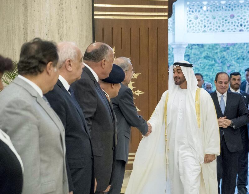 CAIRO, EGYPT - April 10, 2018: HH Sheikh Mohamed bin Zayed Al Nahyan, Crown Prince of Abu Dhabi and Deputy Supreme Commander of the UAE Armed Forces (2nd R), greets a guest, during an official visit to Egypt. Seen with HE Abdel Fattah El Sisi, President of Egypt (R).

( Rashed Al Mansoori / Crown Prince Court - Abu Dhabi )

---
