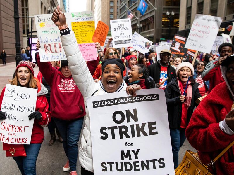 Thousands of striking Chicago Teachers Union members and their supporters march through the Loop, in Chicago. AP Photo