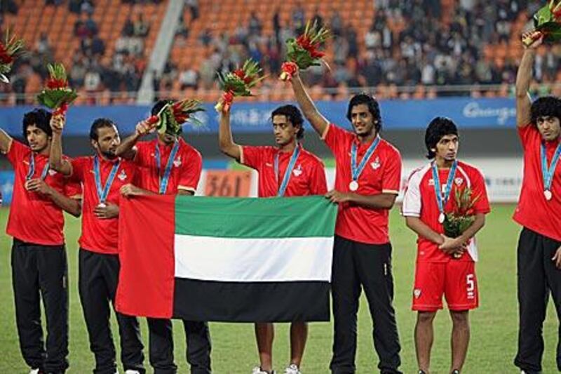 The UAE team celebrate after winning the men's football silver medal at the Asian Games.