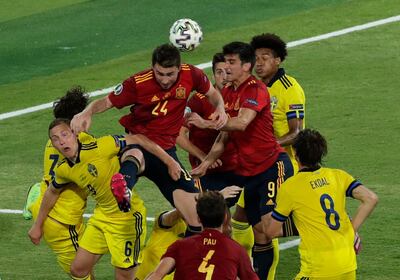 Spain's Aymeric Laporte goes for a header during the Euro 2020 soccer championship group E soccer match between Spain and Sweden, at La Cartuja stadium in Seville, Spain, Monday, June 14, 2021. (Julio Munoz/Pool via AP)