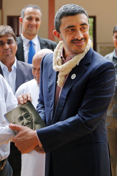 UAE Foreign Minister Abdullah bin Zayed Al Nahyan holds an autobiography of Mahatma Gandhi presented to him during his visit to Gandhi Ashram in Ahmadabad, India, Wednesday, June 27, 2018. (AP Photo/Ajit Solanki)