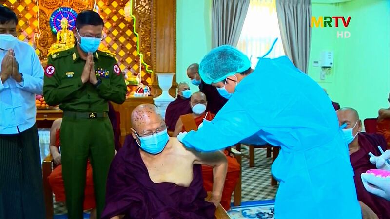 A Buddhist monk is inoculated with a Covid-19 vaccine in Naypyidaw, Myanmar. AFP