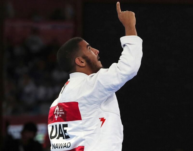 Hamad Nawad of United Arab Emirates reacts after defeating Khalid Alblooshi of United Arab Emirates during their men's -56 kilogram jujitsu final at the 18th Asian Games in Jakarta. AP