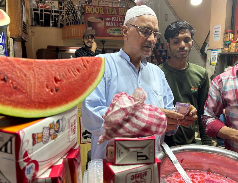Mohammed Khalil, 61, sells Mohabbat-e-sharbat’ or the sherbet of love at Old Delhi. The bright pink drink is made with Rooh Afza, an ultra-sweet concoction of herbs and fruit, milk or water and garnished with diced watermelon. 