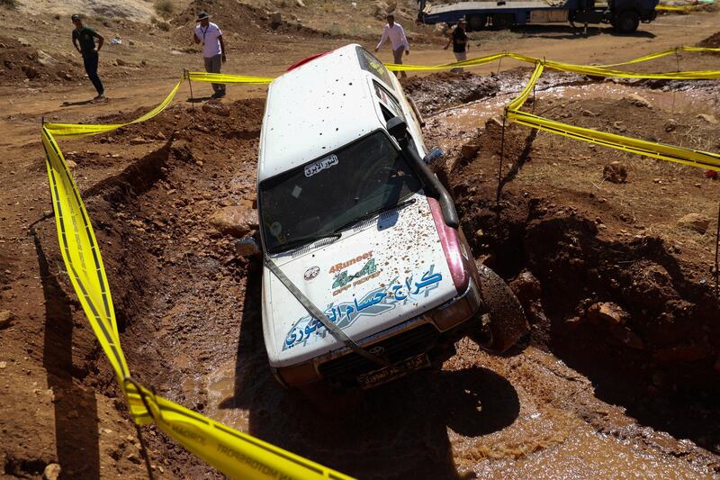 Participants take part in the second round of the Jordan 4x4 championships 2018, at the King of Bahrain forest, near Amman, Jordan. EPA