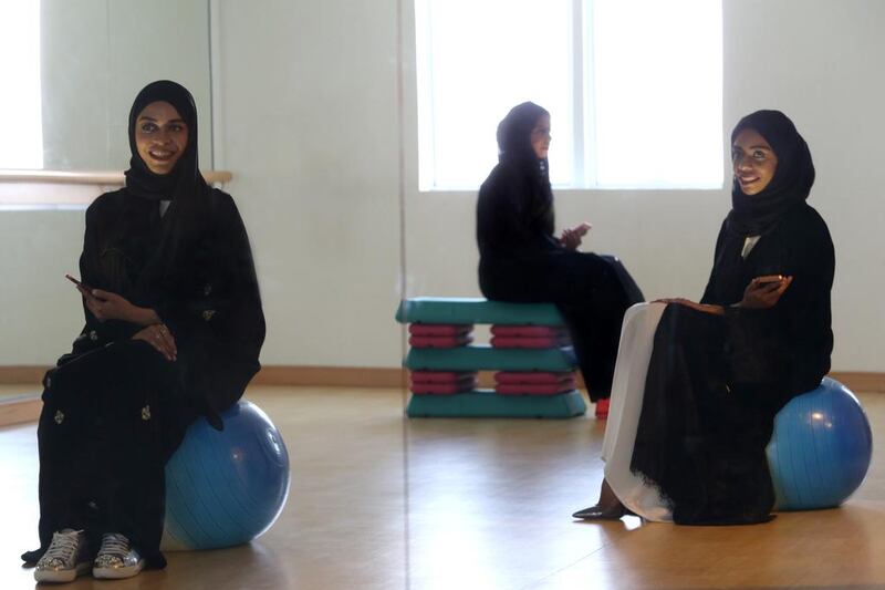 Bouncing back. After their yoga instructor moved to Dubai, sisters Amna, left, Hind, centre, and Mariam Balfaqeh felt at a bit of a loss. Not for long, though. They got together to open Tone Fitness, a studio for women to build healthy bodies and minds. Delores Johnson / The National